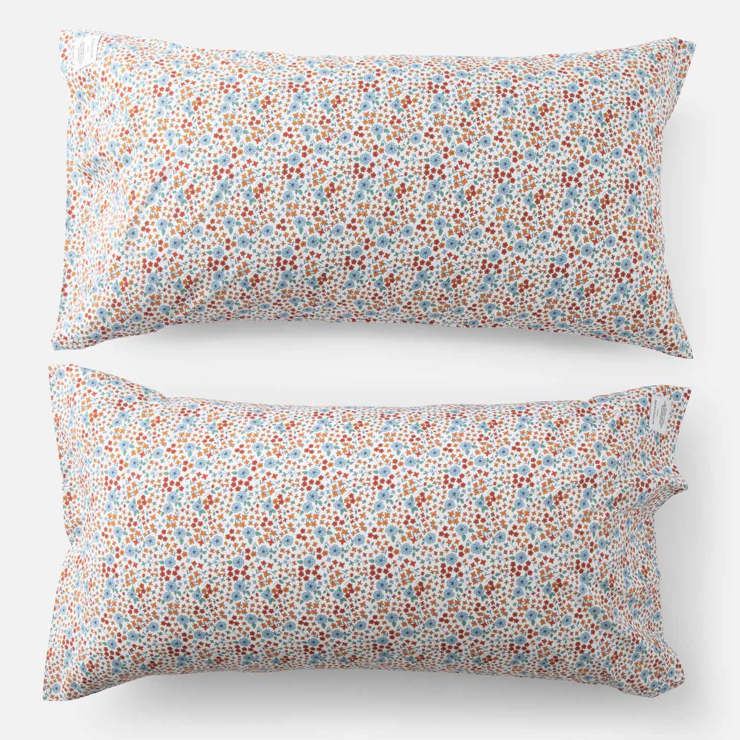 Top-down view of Wallowa Floral Percale pillow case set of 2 showcasing small chamomile floral print on white background