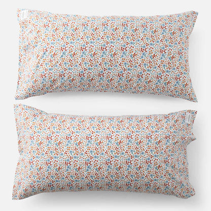 Top-down view of Wallowa Floral Percale pillow case set of 2 showcasing small chamomile floral print on white background