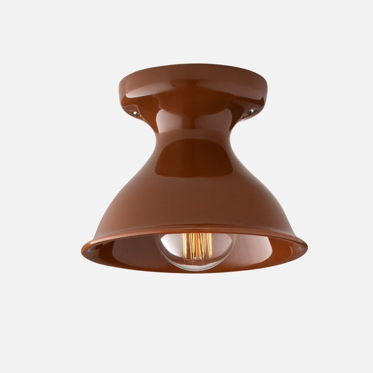 Front view of Alabax flush mount showcasing glossy Auburn metal shade and exposed bulb on light gray background