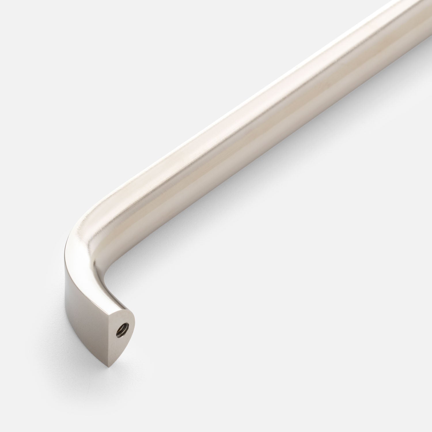 Close-up of Cascade Appliance Pull showcasing its curved bar and rounded end with a light background