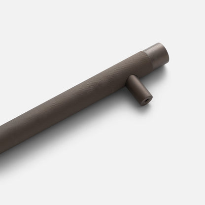 Angled view of Knurled Appliance Pull showcasing textured knurling and mounting post on a white background