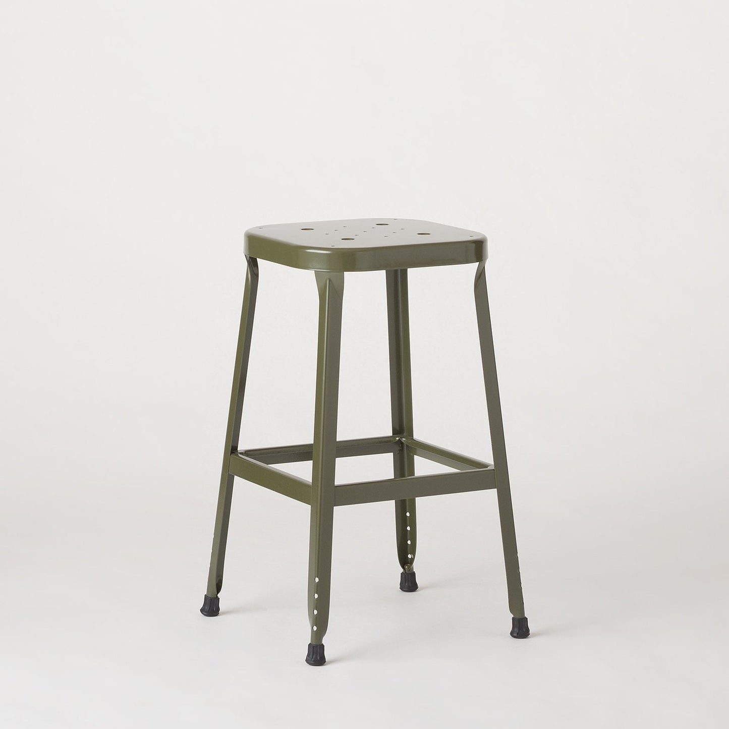 Three-quarter view of Schoolhouse Utility Stool 26-inch showing stamped seat, welded steel frame and rubber feet on plain light background