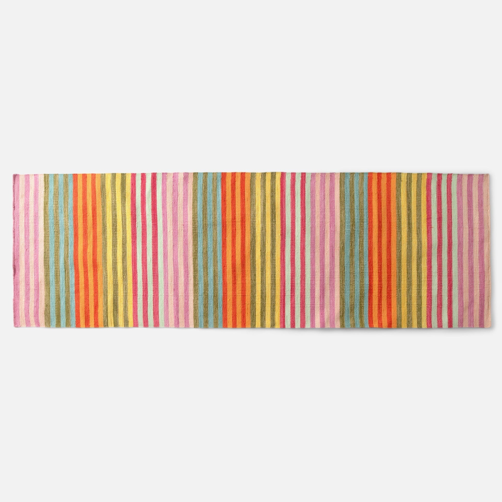 Overhead view of Lisse Performance flatweave runner rug showcasing bold multicolor vertical stripes on white background