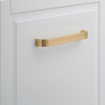 Front view of Cascade Appliance Pull showcasing its curved gold-tone design on a white cabinet