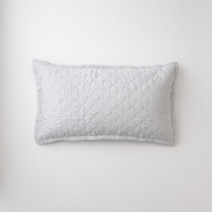 Top view of Diamond Ticking Quilted Pillow Sham showing diamond quilting and gray ticking on white background